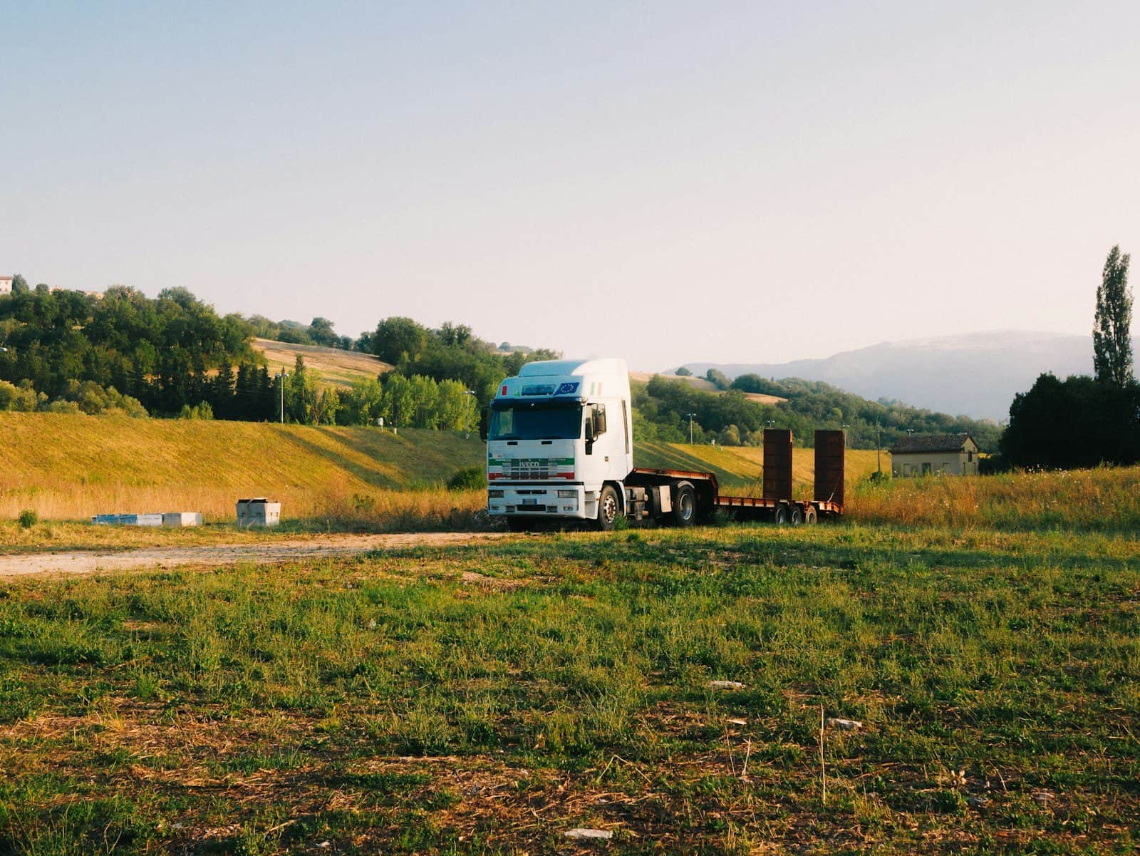 A tractor unit coupled to an open flatbed trailer