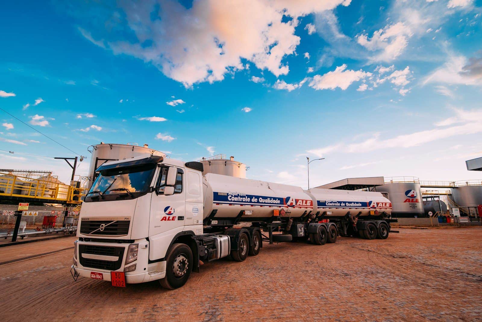 A tanker rig standing on a hardstanding under an open sky